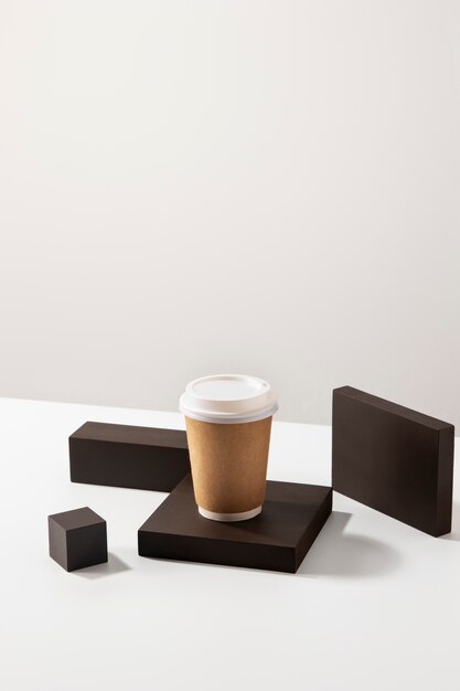 Coffee cup with wooden boards high angle