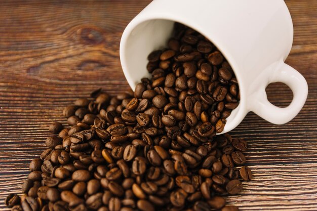 Coffee grains scattering from cup 