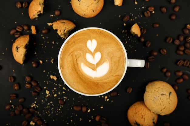 Coffee latte with cookies and coffiee beans