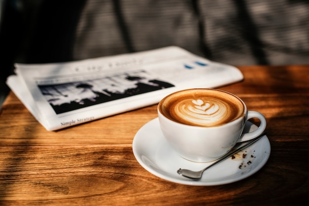 Free Photo coffee shop cafe latte cappuccino newspaper concept