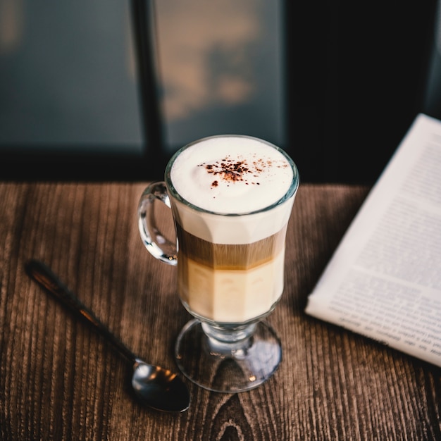 Free photo coffee shop cafe latte cappuccino newspaper concept