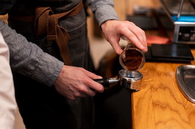 Coffee shop employee making coffee