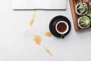 Free photo coffee spilled over workspace