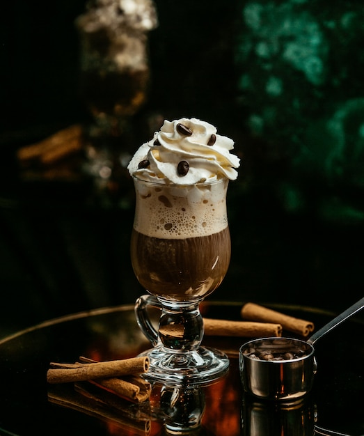 coffee topped with whipped cream and coffee seeds