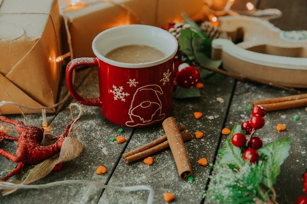 Coffee with milk and cinnamon on the table __