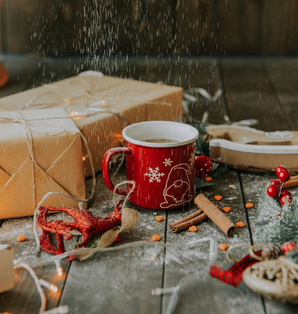 Coffee with milk and gifts under white powder