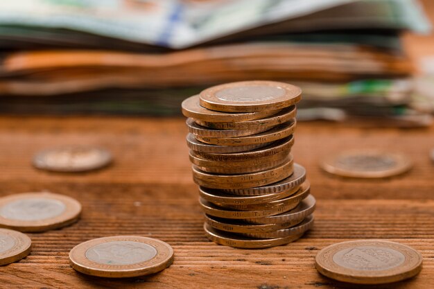 coins, banknotes on wooden table .