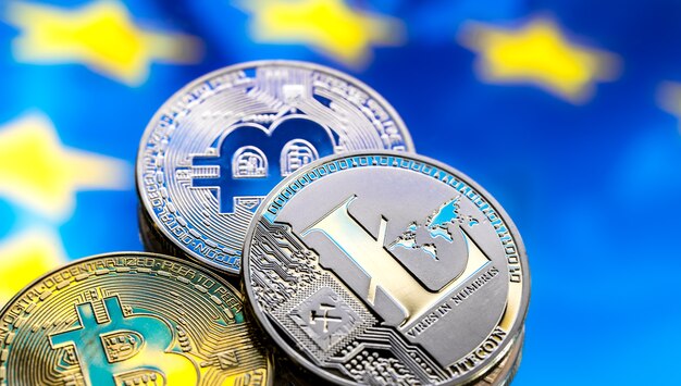 coins Bitcoin and litecoin on the background of Europe. Concept of virtual money