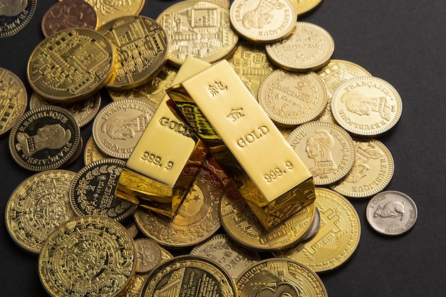 Free Photo coins, and gold bars scattered on a table