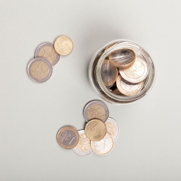 Coins in a jar flat lay