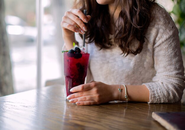 Cold berry cocktail with pipe