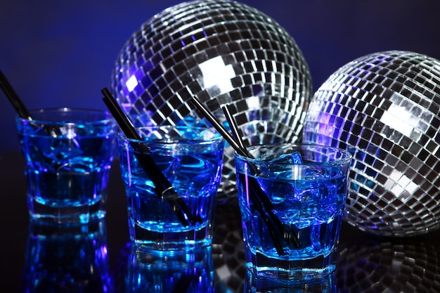 Cold blue cocktail with disco ball