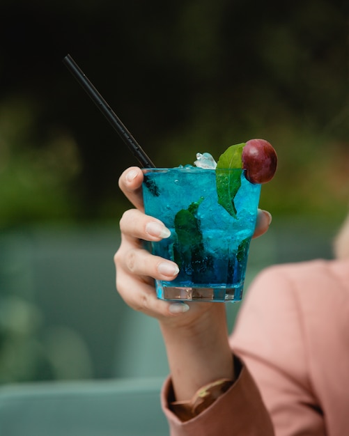 cold blue cocktail with grape