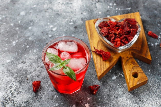 Free Photo cold brew hibiscus tea with ice and basil leaves.