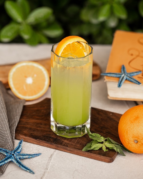 cold lemon cocktail with orange slice