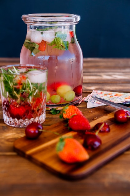 Free Photo cold refreshing drink with strawberries and mint in jar