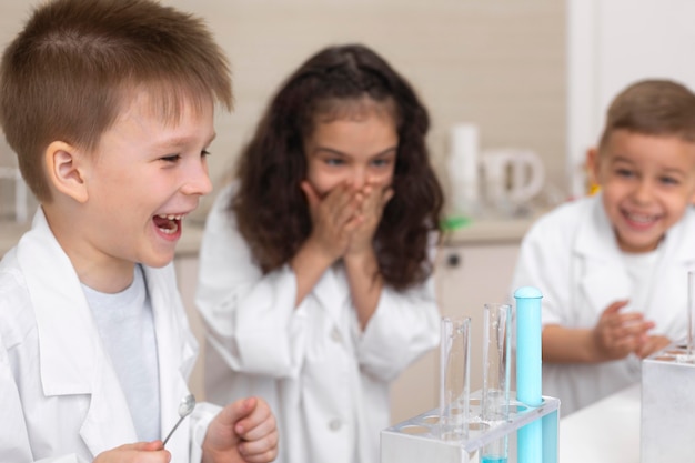 Colleagues doing a chemical experiment at school