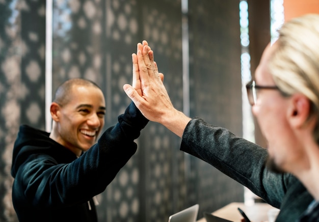 Free Photo colleagues giving a high five