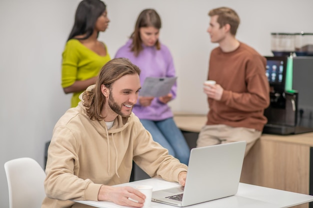 Free Photo colleagues. a group of colleagues discussing something and looking involved