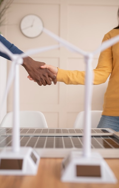 Free photo colleagues handshake close up