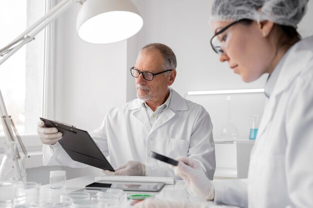 Colleagues in laboratory doing experiments