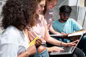 Free photo colleagues studying together for an exam