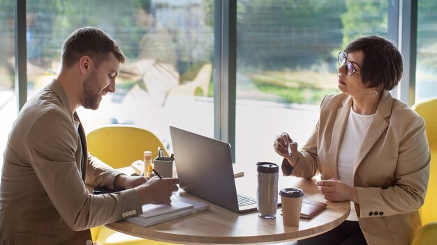 Colleagues working in cozy office side view