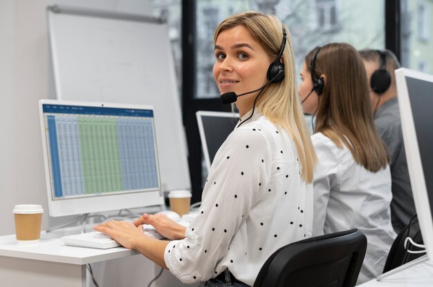 Colleagues working together in a call center office