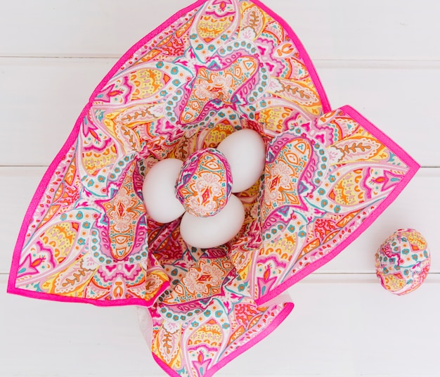 Free photo collection of colourful easter eggs in napkin