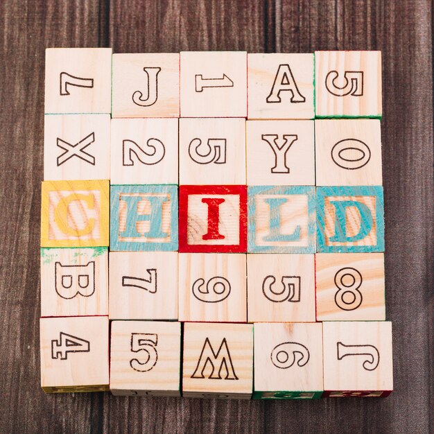 Collection of wooden cubes with child inscription