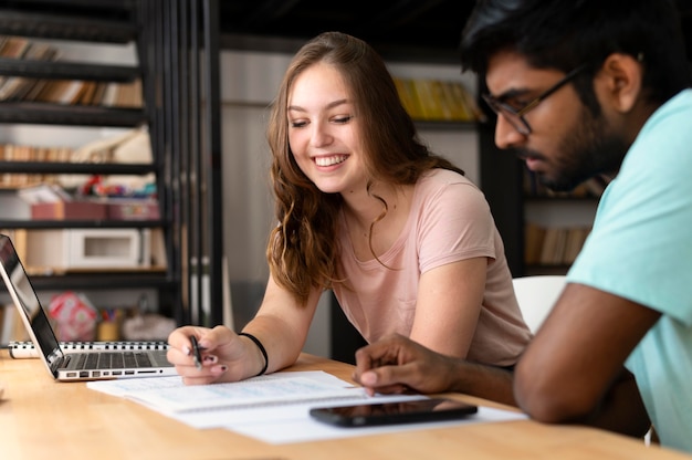 College girl and boy studying together