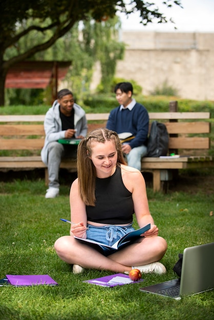 Free photo college students cramming outdoor