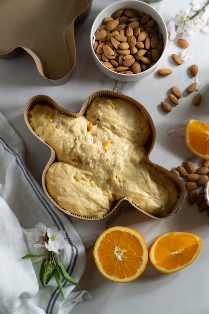 Colomba dough and almonds flat lay