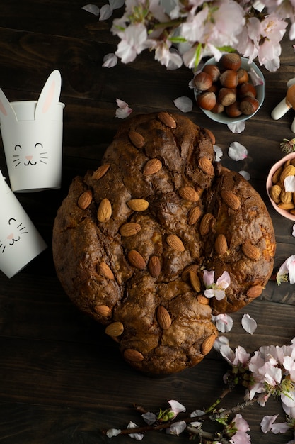 Free Photo colomba with almonds and flowers top view