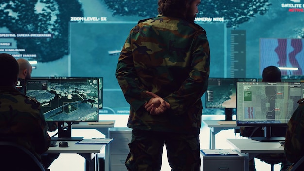 Free photo colonel overseeing special operation to gather intelligence in control center