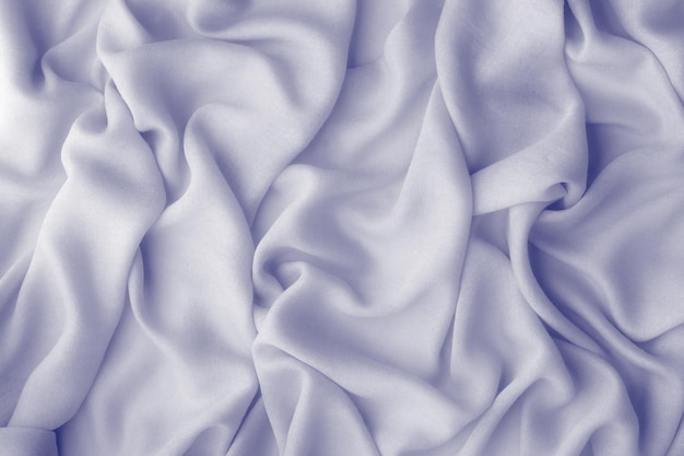 Free photo color 2022, very peri, fabric texture for design. light purple blue abstract background. top view