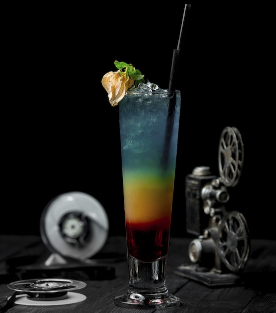 Free Photo color alcohol cocktail wiith flower and black pipe.