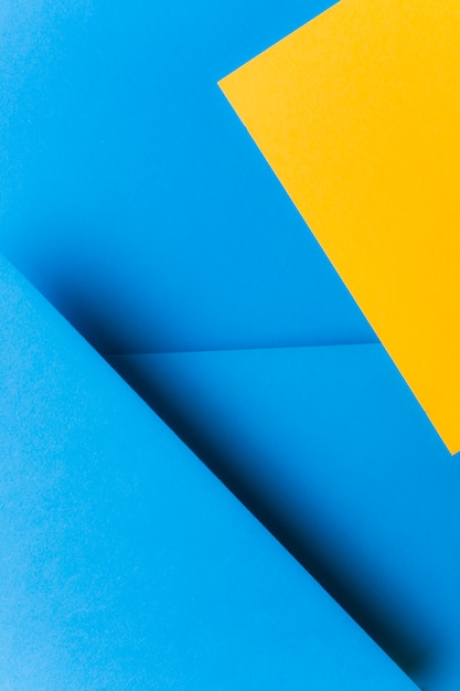 Free Photo color two tone blue and yellow paper background