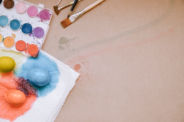 Colored Easter eggs drying on paper