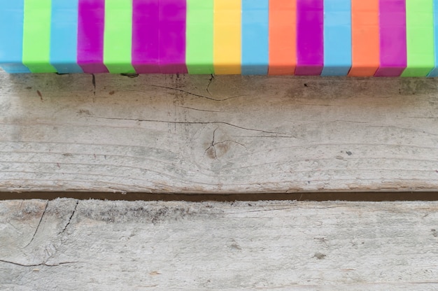 Colored elements on wooden texture