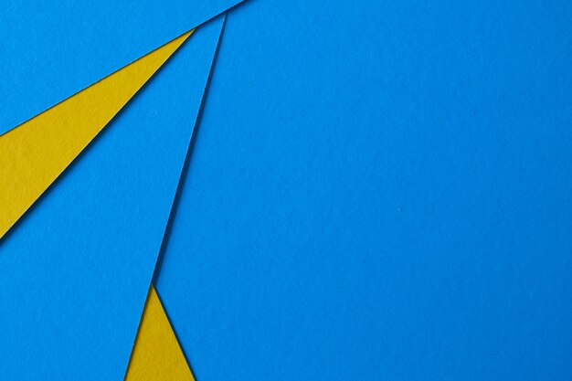 Colored geometric blue and yellow paper texture background