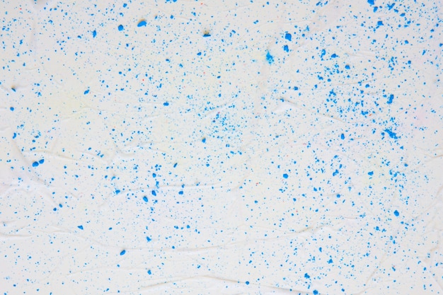 Free photo colored paper texture with blue dots