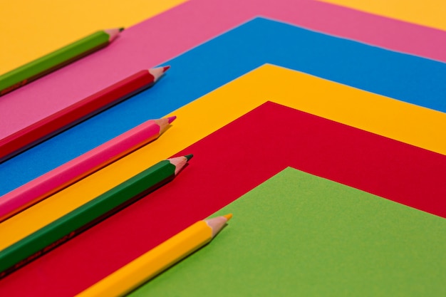 Colored pencils and colour paper sheets