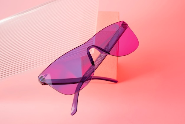 Free photo colored transparent sunglasses  still life