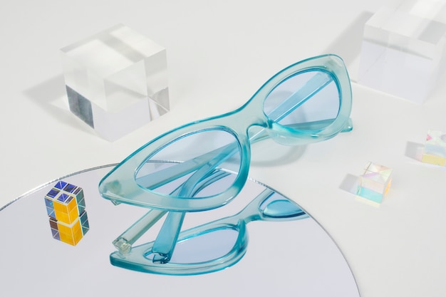 Free Photo colored transparent sunglasses  still life