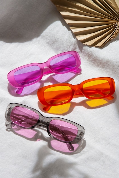 Free photo colored transparent sunglasses  still life