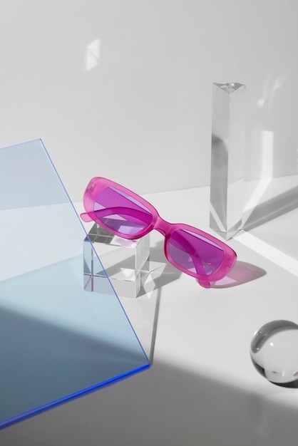 Free photo colored transparent sunglasses  still life