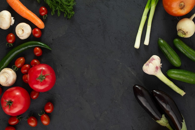 Colored vegetables fresh on black desk