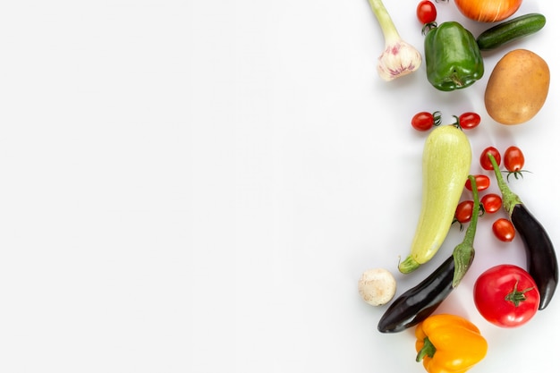 Colored vegetables on white background