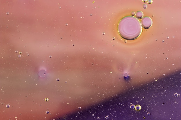 Free Photo colorful abstract background with oil bubbles floating on water